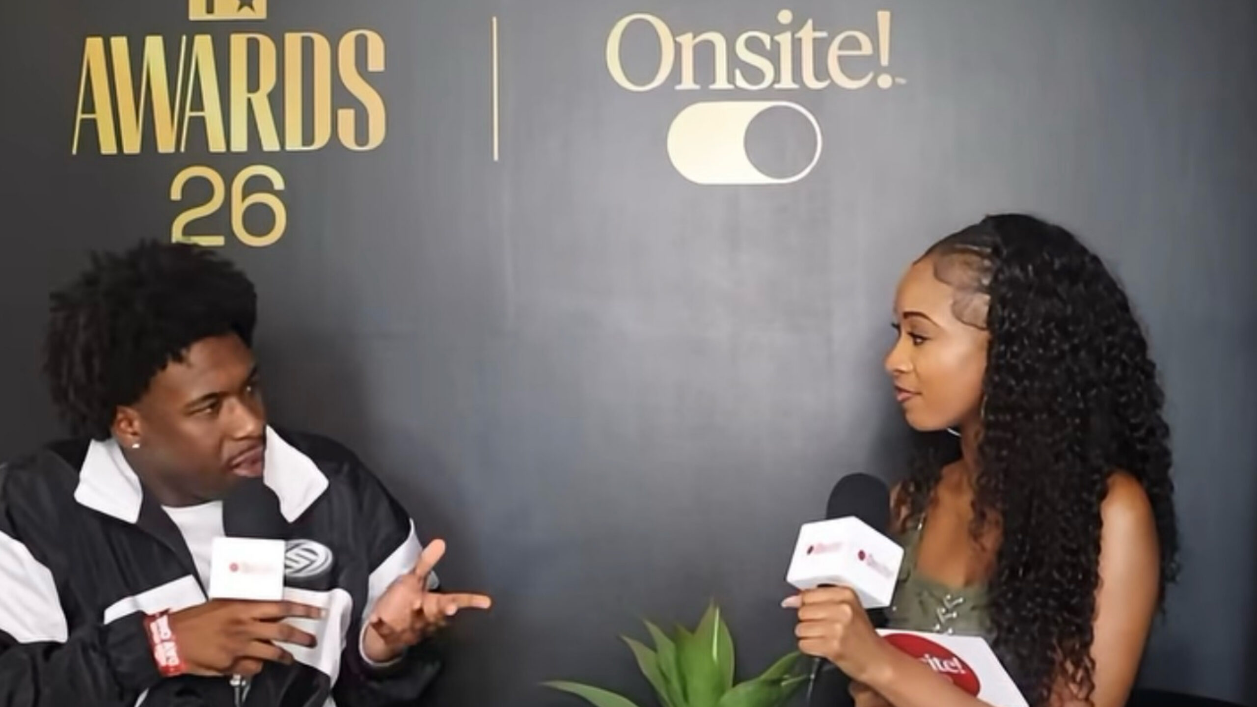 An Onsite! Media correspondent interviews a guest at the BET Awards 2026 Media House, with the BET Awards 26 and Onsite! branded backdrop visible behind them.