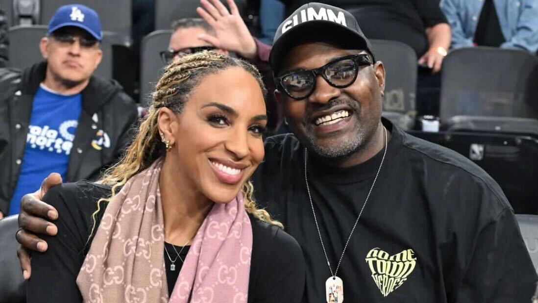 Marcellus Wiley and Annemarie Wiley posing together at an event.