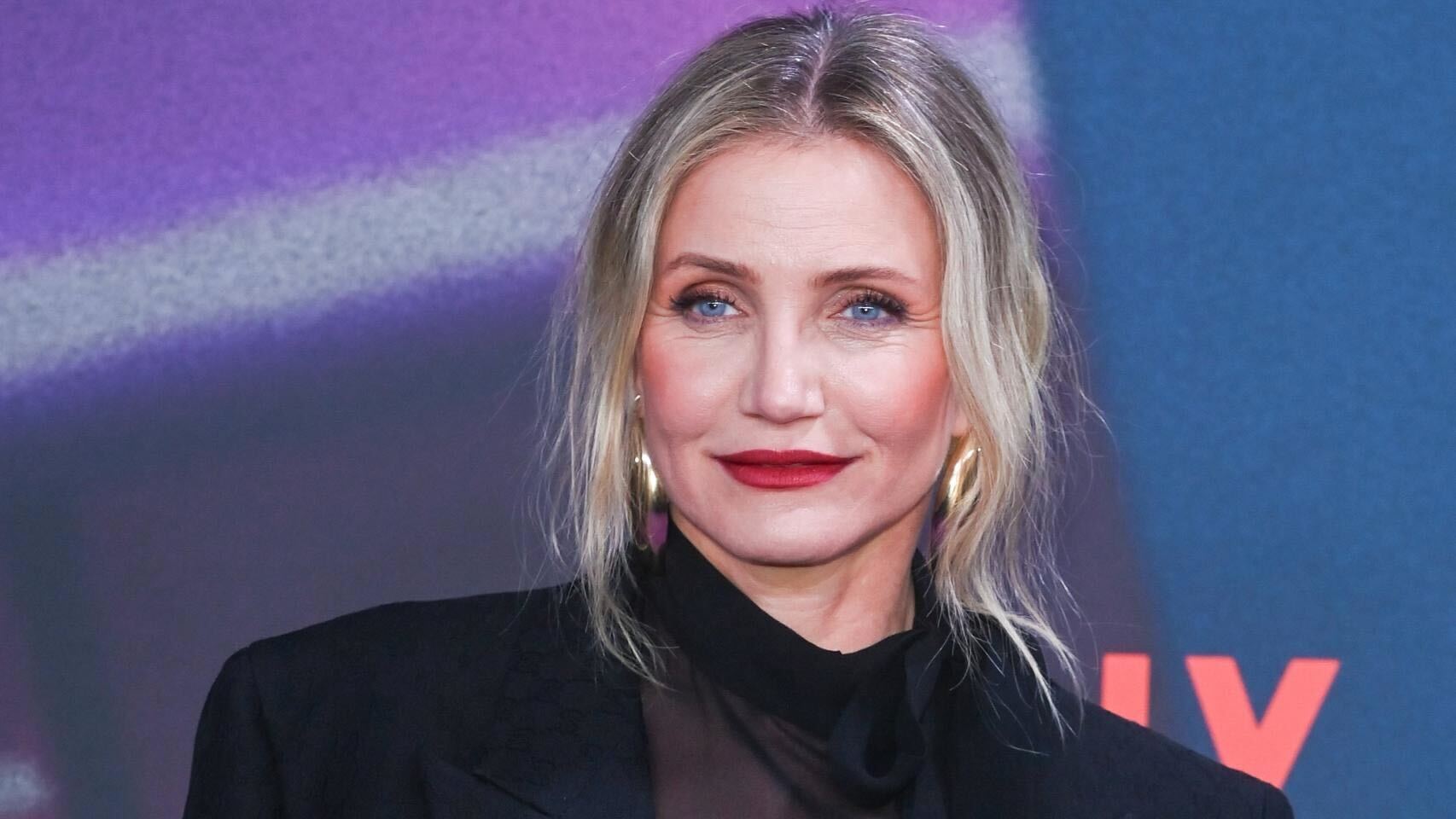 A recent picture of Cameron Diaz on a black corporate outfit and beautiful makeup.